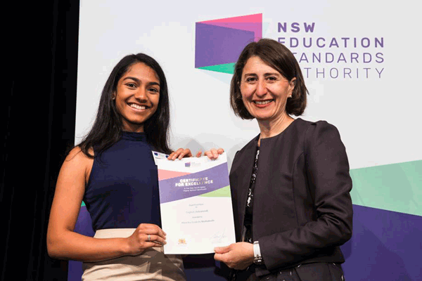 Hansika Muthukuda receives her certifcate from NSW Premier Gladys Berejiklian at the presentation on December 13. – Lawrence Machado, Hills Shire Times