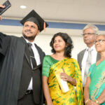 An OUSL graduate with his family