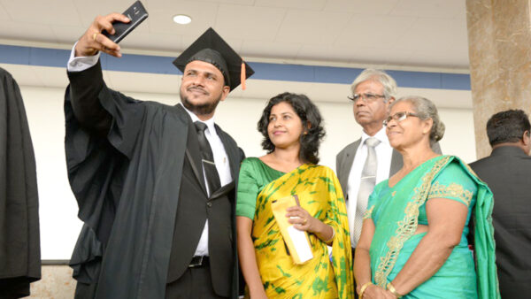 An OUSL graduate with his family