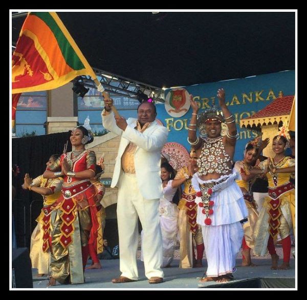 A Proud Sri Lankan American Waves the Lion Flag of Sri Lanka at the Sri Lanka Foundation's "Sri Lanka Day" in Pasadena, Ca.