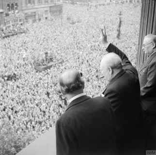 Churchill waves to the crowds below