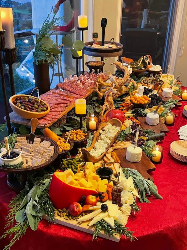 Sara Johns transformed a blank table into a Charcuterie masterpiece of cheeses, meats, fruits, vegetables, and sauces for the annual Rutnam Family Christmas Party for 40 people (below).