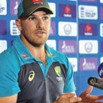 Aaron Finch briefing the media