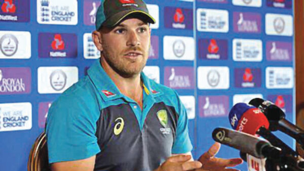 Aaron Finch briefing the media
