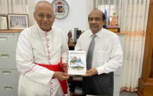 PRESENTING MY BOOK, THE EXTRA MILE TO HIS EMINENCE MALCOLM CARDINAL RANJITH