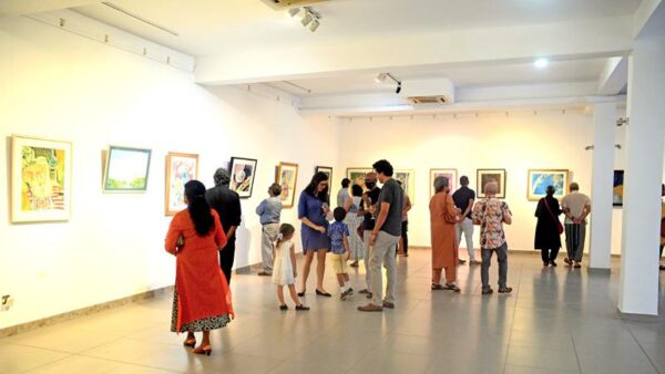 Guests at the gallery viewing the works of Beven