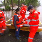 Doctor's mercy dash across surging floodwaters to help patients