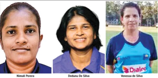 Two women umpires and match referee
