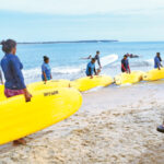 Women surfers during their training