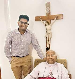 The writer with Archbishop Emeritus Oswald Gomis