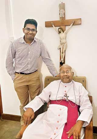 The writer with Archbishop Emeritus Oswald Gomis