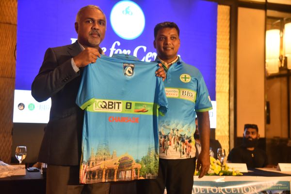 1. Mr. Noel Suganthan (CEO, SpotOn Money - Gold Sponsor) and Mr. S. Sugathan (CEO, VSS Products - Sponsor) unveiling the official Ride for Ceylon t-shirt for 2026.